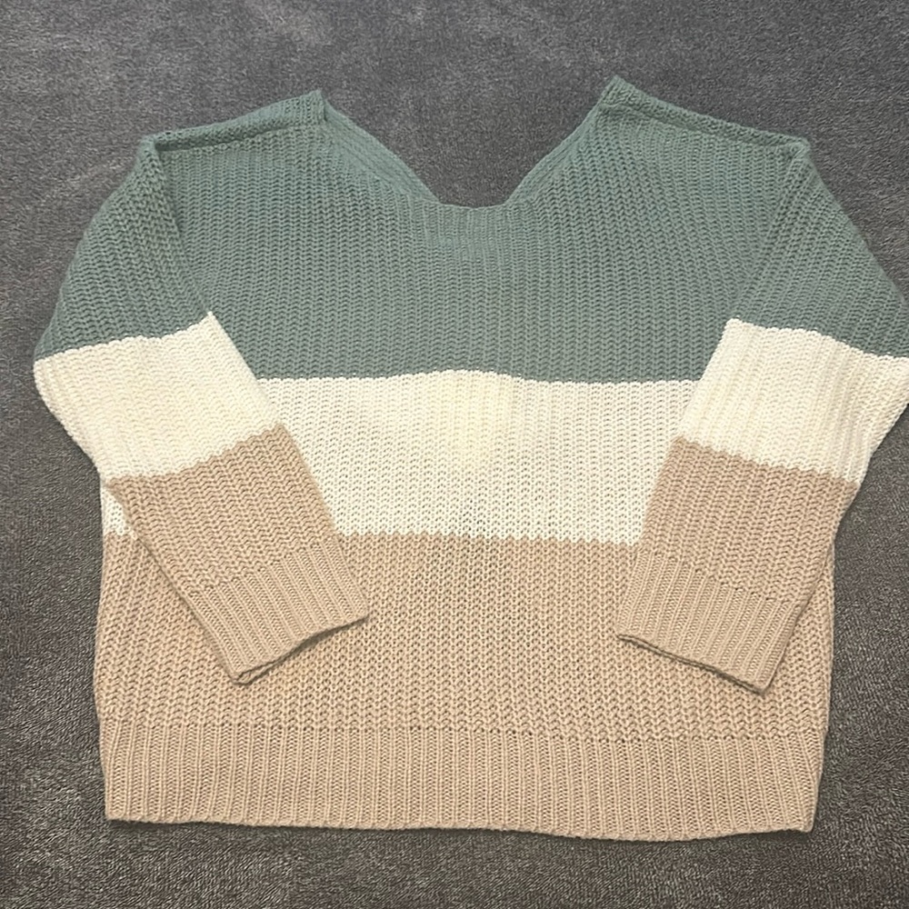 Super cute sweater size large with open back